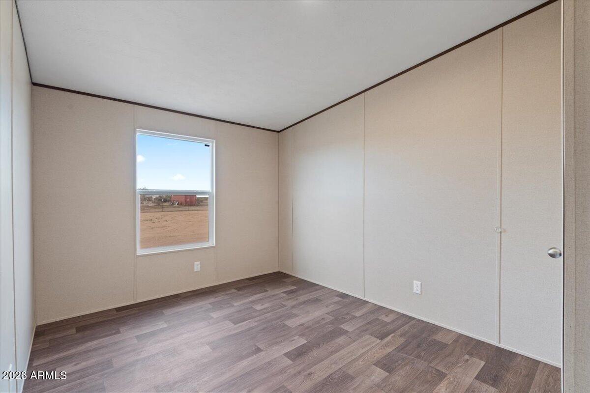 53512 West Organ Pipe Road Maricopa, AZ 85139 - Photo 33 of 44 an empty room with a window