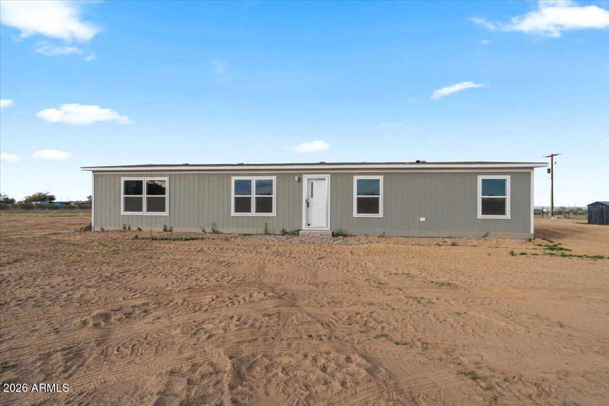 53512 West Organ Pipe Road Maricopa, AZ 85139 - Photo 3 of 44 a view of a house with backyard and trees
