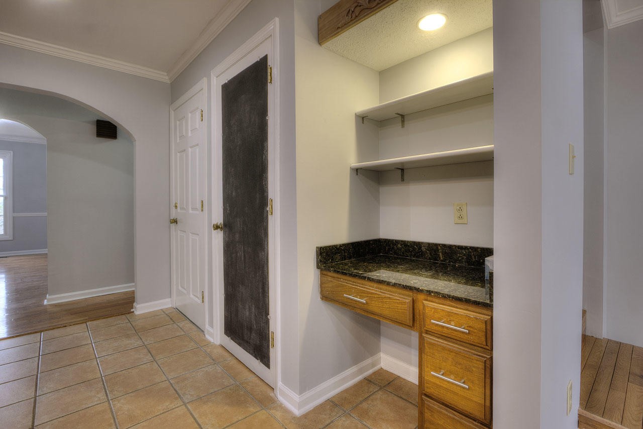 428 Ferret Road Knoxville, TN 37934 - Photo 11 of 38 a kitchen with granite countertop a sink and a stove