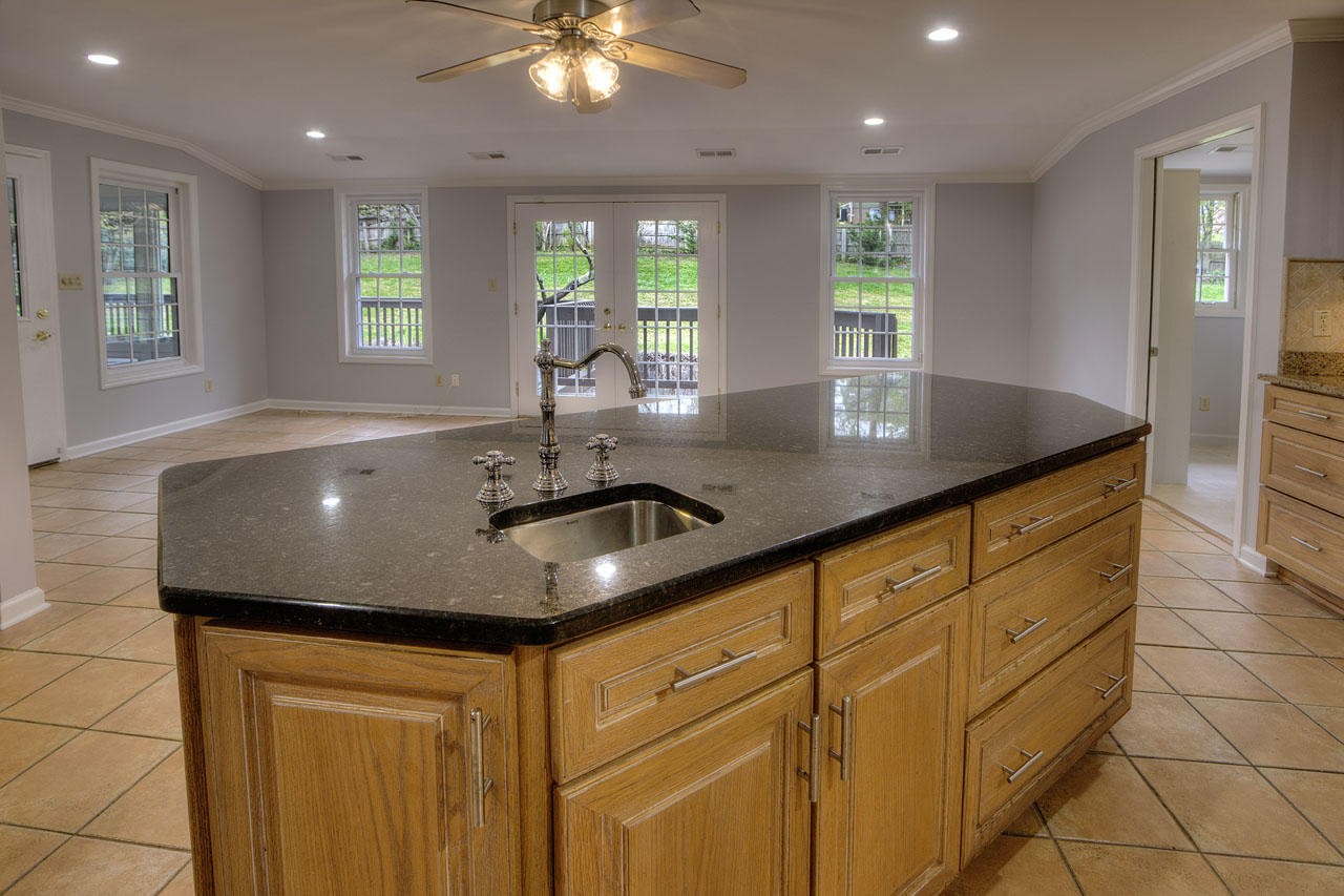 428 Ferret Road Knoxville, TN 37934 - Photo 14 of 38 a kitchen with kitchen island granite countertop a sink and a large window