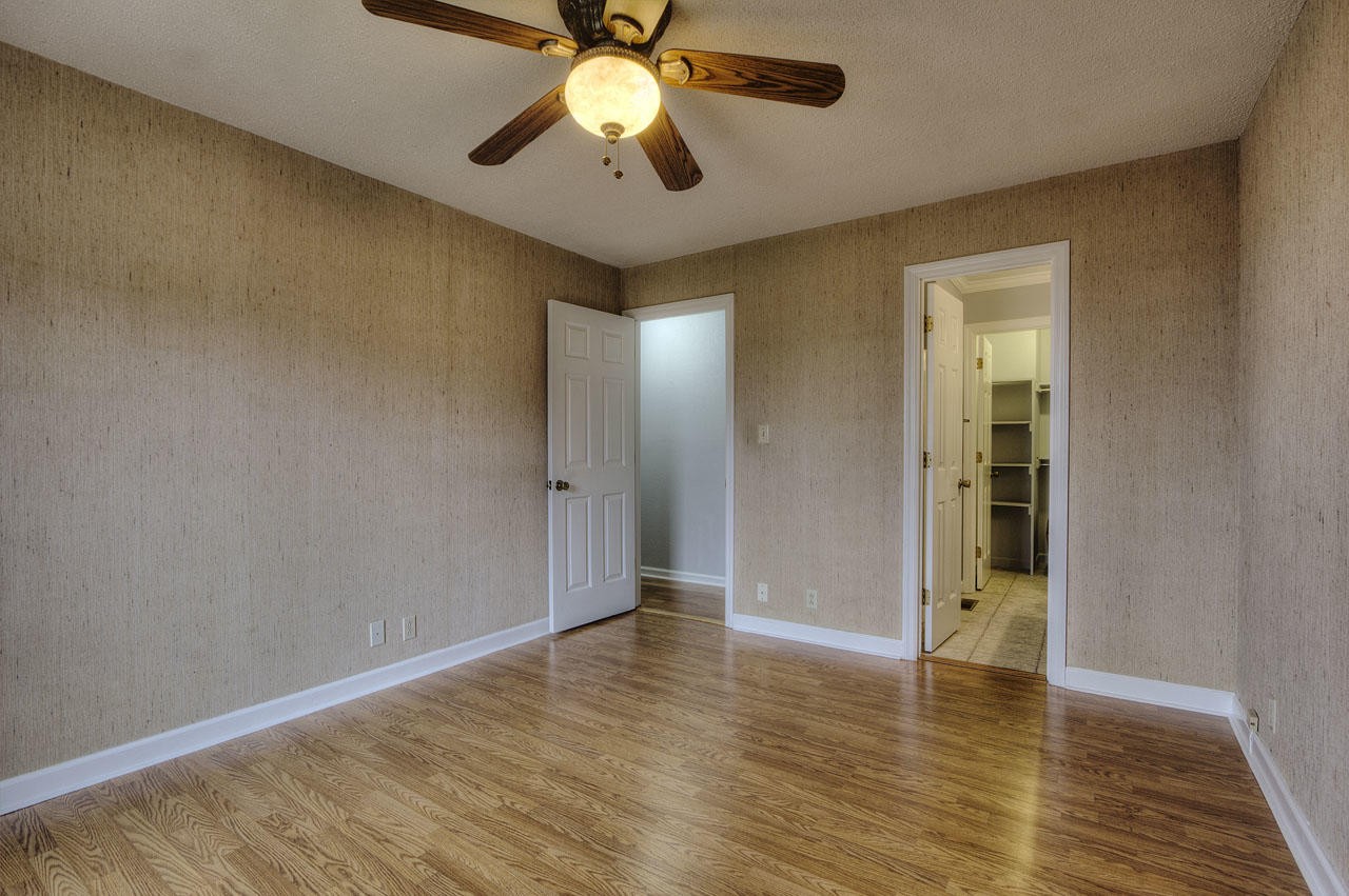 428 Ferret Road Knoxville, TN 37934 - Photo 16 of 38 an empty room with wooden floor and windows