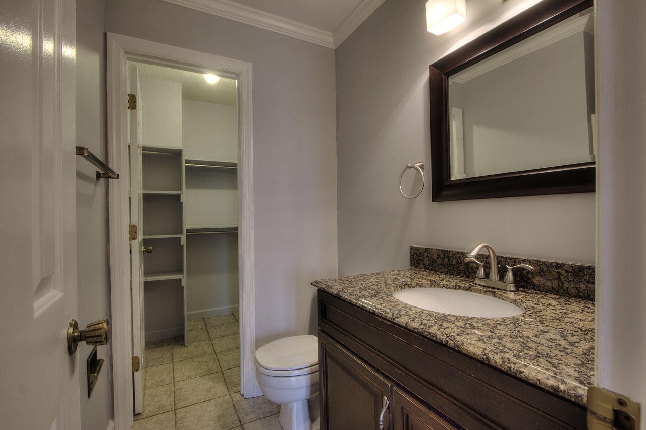 428 Ferret Road Knoxville, TN 37934 - Photo 17 of 38 a bathroom with a granite countertop sink toilet and mirror