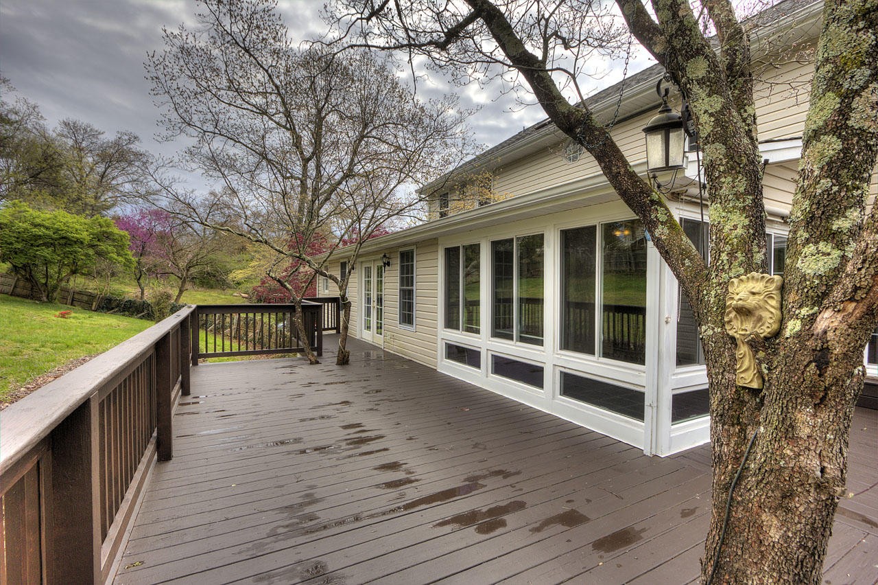 428 Ferret Road Knoxville, TN 37934 - Photo 19 of 38 a view of a house with wooden deck next to a yard