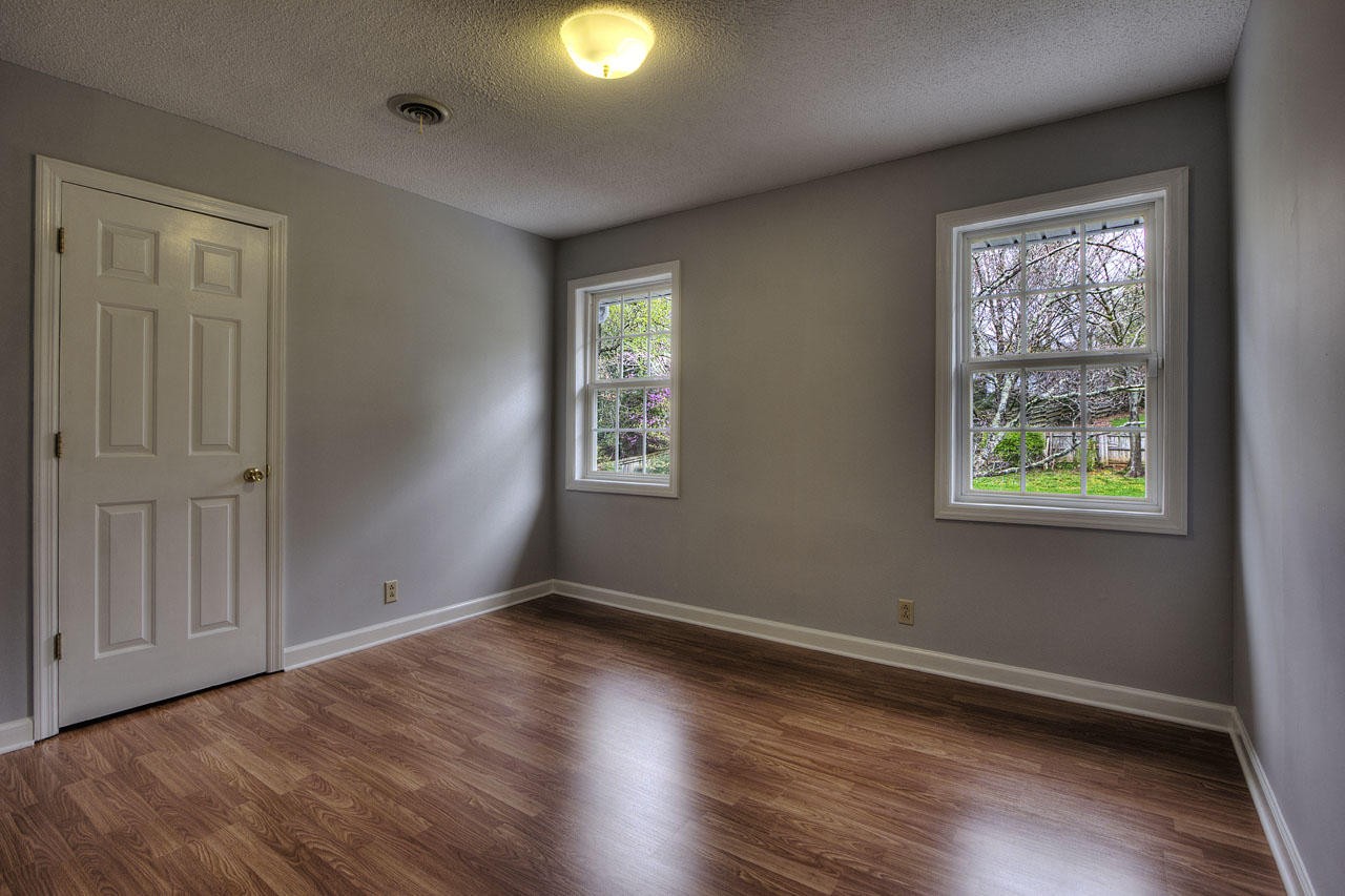 428 Ferret Road Knoxville, TN 37934 - Photo 29 of 38 a view of an empty room with wooden floor and a window