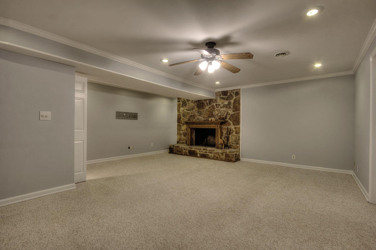 428 Ferret Road Knoxville, TN 37934 - Photo 31 of 38 an empty room with windows and fireplace