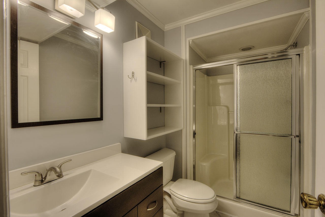 428 Ferret Road Knoxville, TN 37934 - Photo 34 of 38 a bathroom with a sink toilet vanity and shower