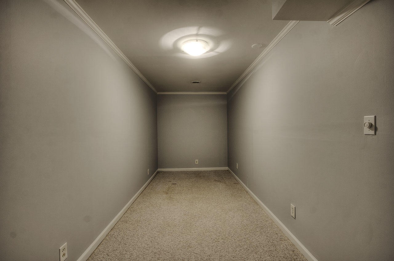 428 Ferret Road Knoxville, TN 37934 - Photo 35 of 38 an empty room with a ceiling fan and window