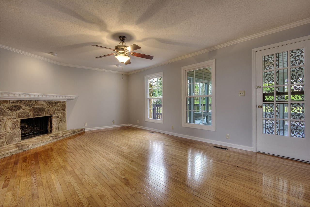 428 Ferret Road Knoxville, TN 37934 - Photo 6 of 38 a view of an empty room with wooden floor and a window