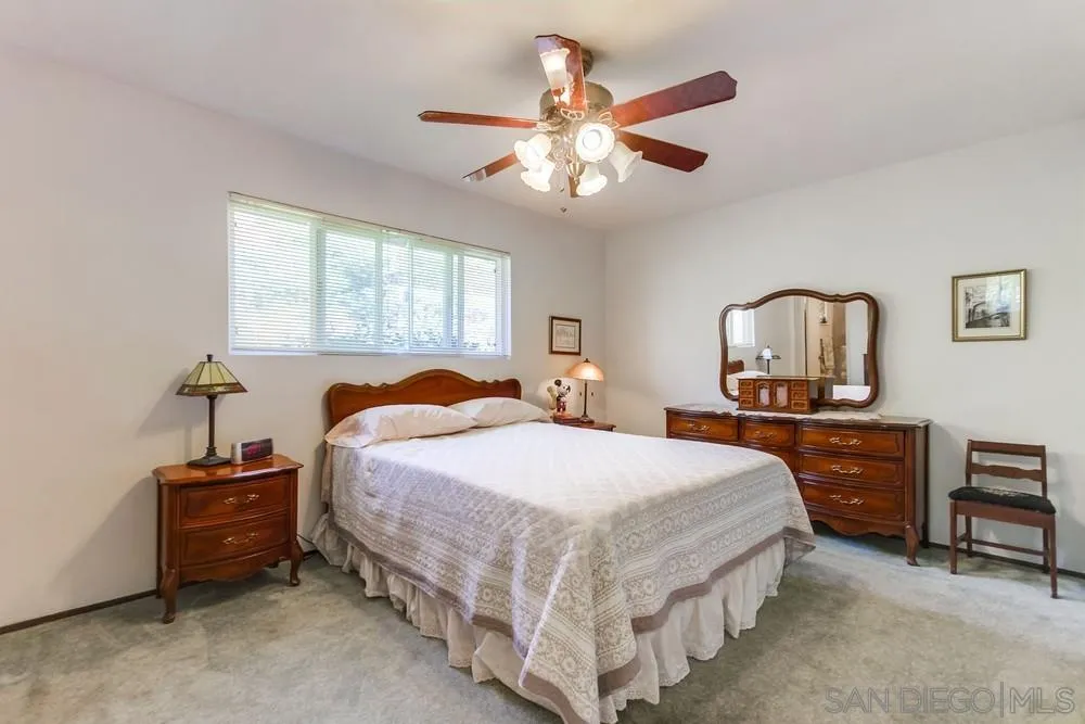 9140 Inverness Road Santee, CA 92071 - Photo 21 of 41 a bedroom with a bed and a table in it