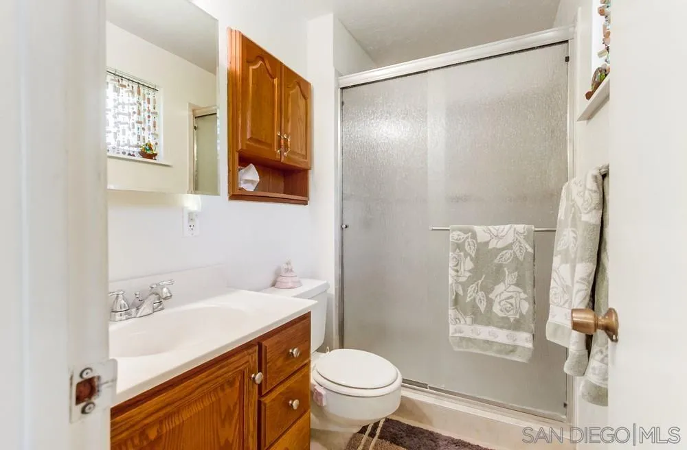 9140 Inverness Road Santee, CA 92071 - Photo 24 of 41 a bathroom with a sink toilet and shower
