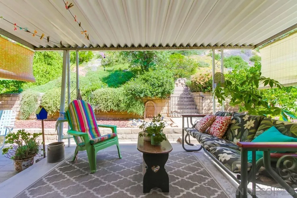 9140 Inverness Road Santee, CA 92071 - Photo 30 of 41 a view of a porch with chairs and plants