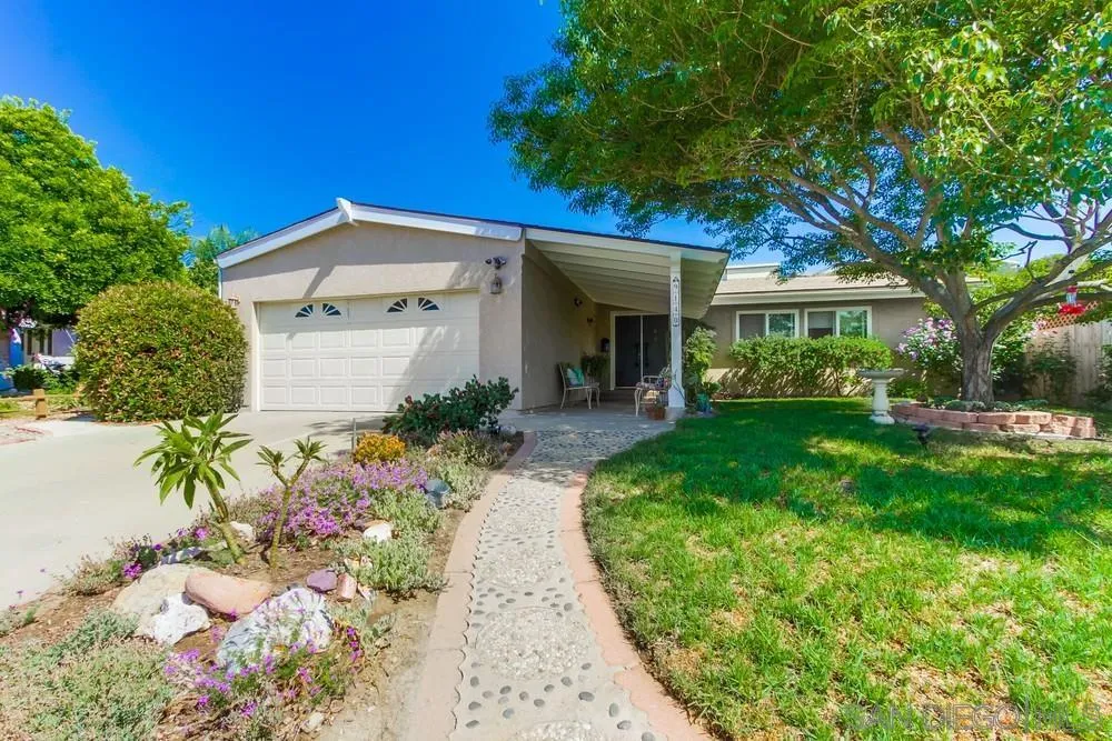 9140 Inverness Road Santee, CA 92071 - Photo 3 of 41 a front view of a house with a yard