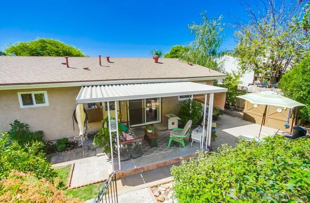 9140 Inverness Road Santee, CA 92071 - Photo 39 of 41 a view of a patio with table and chairs potted plants