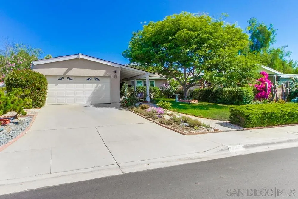 9140 Inverness Road Santee, CA 92071 - Photo 4 of 41 a front view of a house with a yard and garage