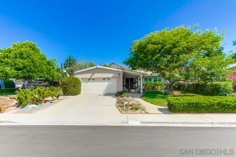 9140 Inverness Road Santee, CA 92071 - Photo 5 of 41 a front view of a house with a yard and garage