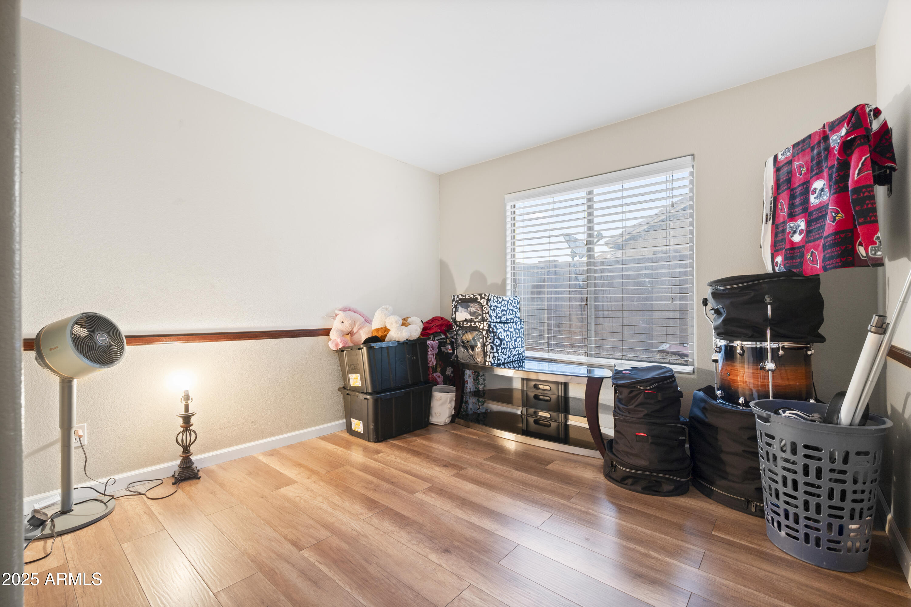 6419 West Briles Road Phoenix, AZ 85083 - Photo 14 of 28 a bed room with furniture and a window
