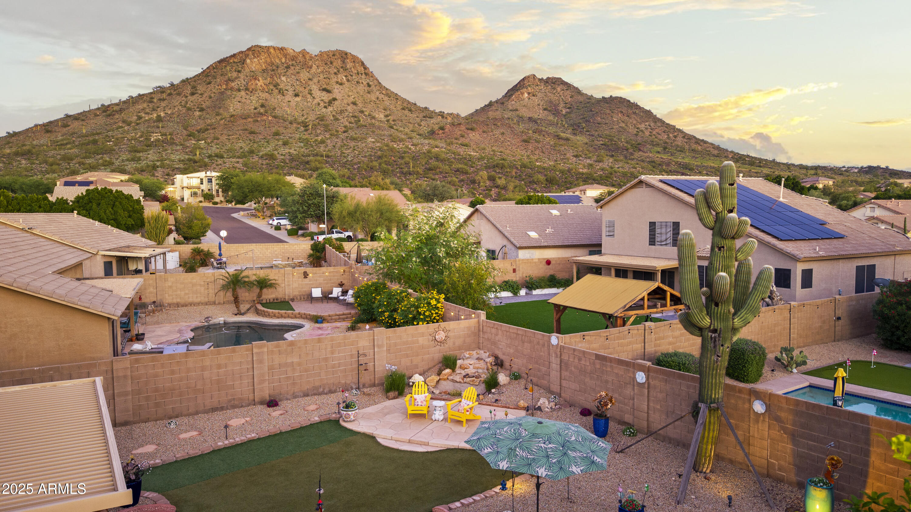 6419 West Briles Road Phoenix, AZ 85083 - Photo 4 of 28 an aerial view of residential houses with outdoor space