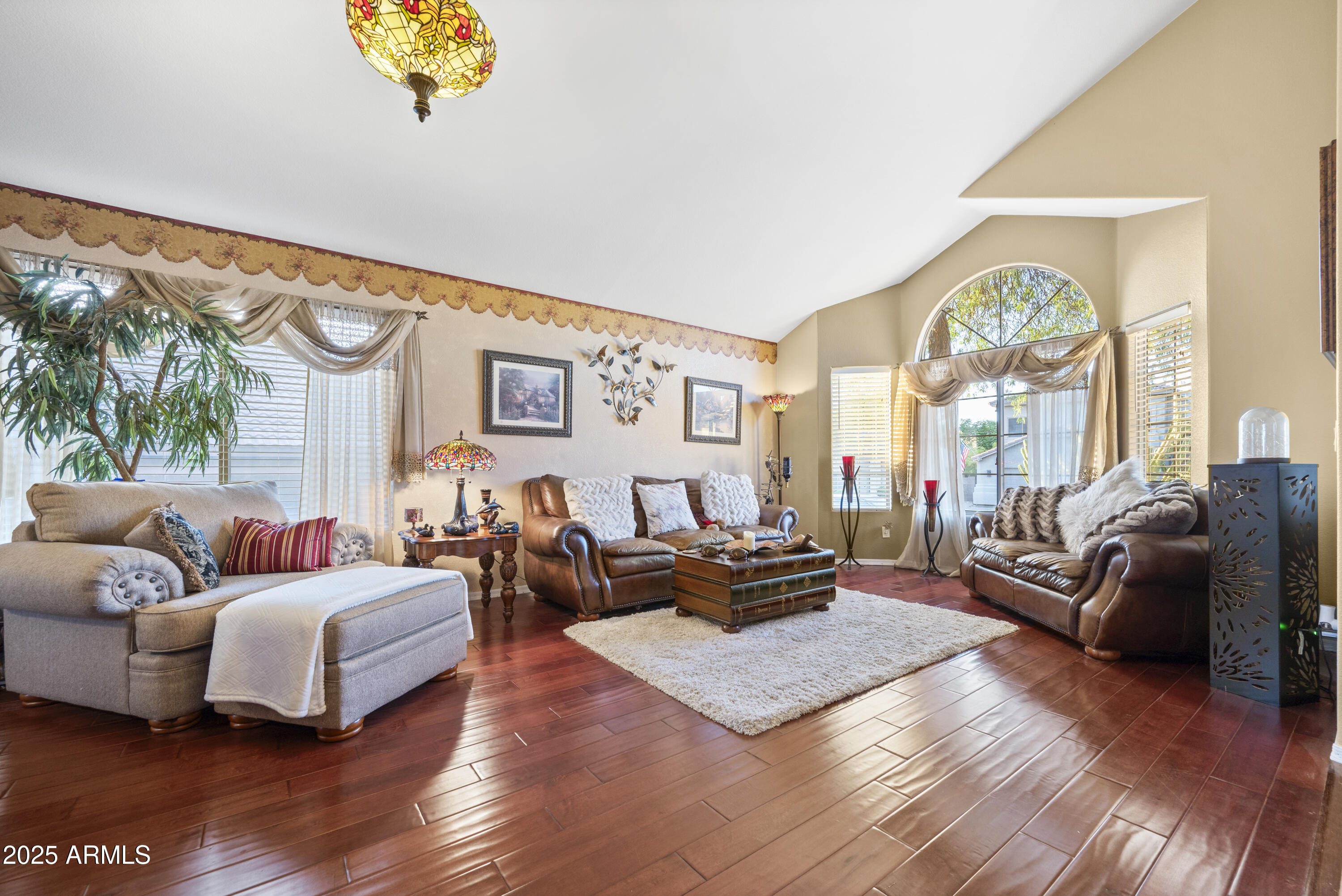 6419 West Briles Road Phoenix, AZ 85083 - Photo 6 of 28 a living room with furniture fireplace and a large window