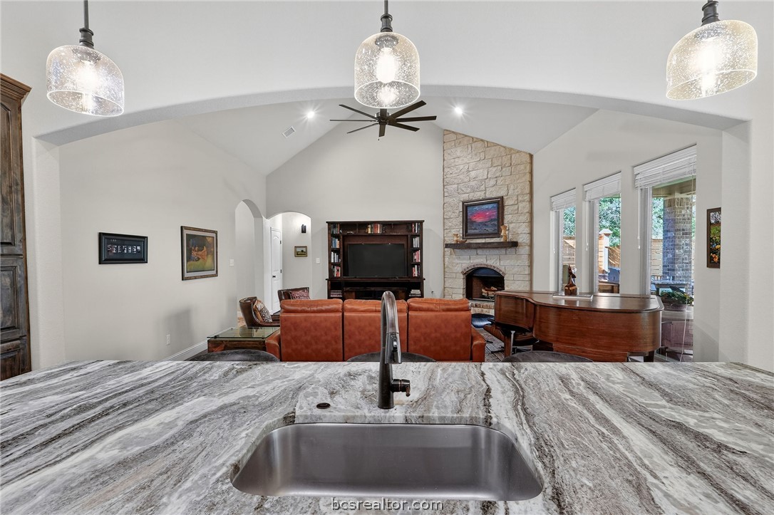 2004 Lexi Lane Bryan, TX 77807 - Photo 11 of 47 a living room with furniture a fireplace and a flat screen tv