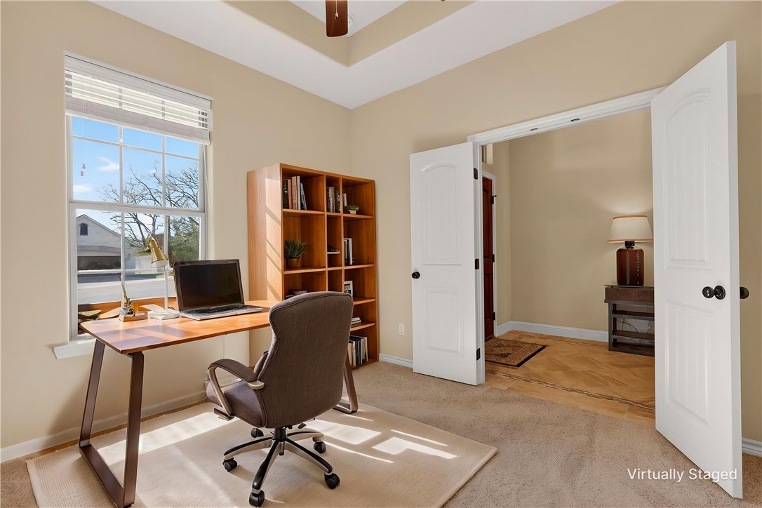 2004 Lexi Lane Bryan, TX 77807 - Photo 14 of 47 a view of a workspace with furniture and a window