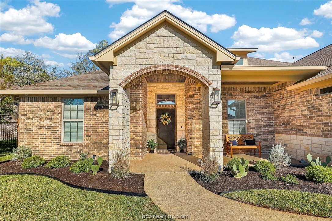 2004 Lexi Lane Bryan, TX 77807 - Photo 2 of 47 a view of a brick house with large windows