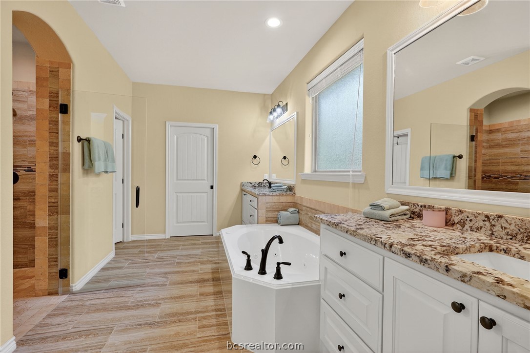 2004 Lexi Lane Bryan, TX 77807 - Photo 21 of 47 a bathroom with a sink and a mirror