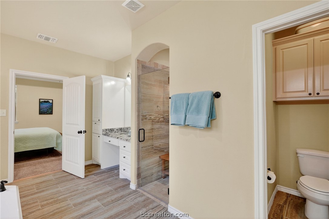 2004 Lexi Lane Bryan, TX 77807 - Photo 24 of 47 a bathroom with a sink and a toilet