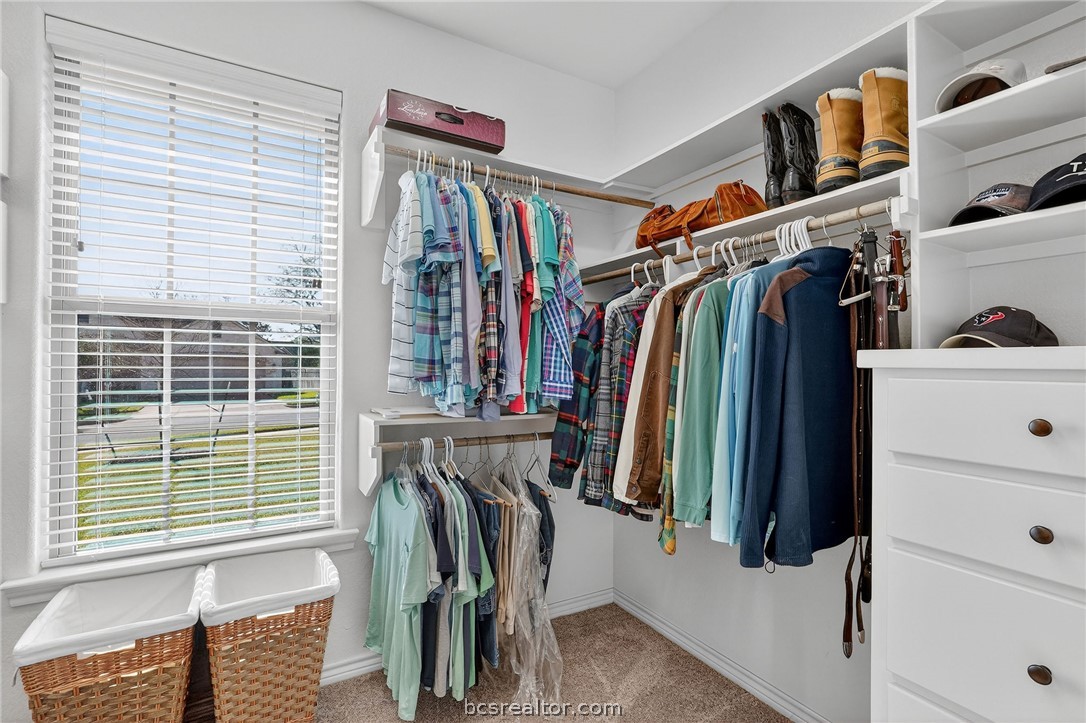 2004 Lexi Lane Bryan, TX 77807 - Photo 27 of 47 a view of walk in closet with clothes and shoes