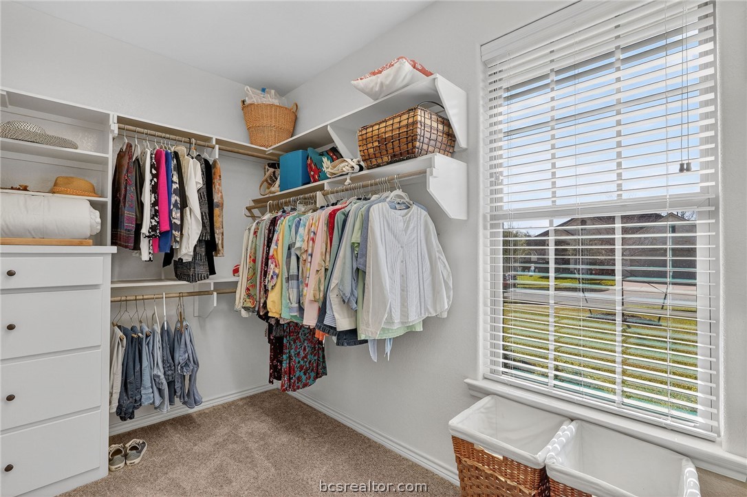 2004 Lexi Lane Bryan, TX 77807 - Photo 28 of 47 a view of walk in closet with clothes and shoes