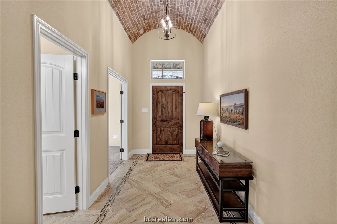 2004 Lexi Lane Bryan, TX 77807 - Photo 3 of 47 a view of a hallway with wooden floor and windows