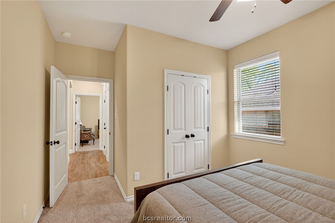2004 Lexi Lane Bryan, TX 77807 - Photo 33 of 47 a view of a livingroom with a chandelier fan and a bathroom