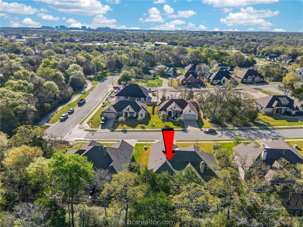 2004 Lexi Lane Bryan, TX 77807 - Photo 45 of 47 an aerial view of residential houses with outdoor space and swimming pool