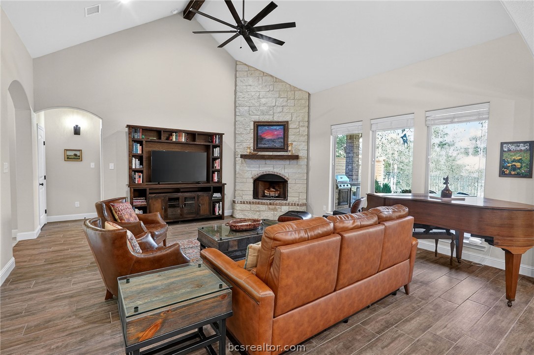 2004 Lexi Lane Bryan, TX 77807 - Photo 5 of 47 a living room with furniture a fireplace and a flat screen tv