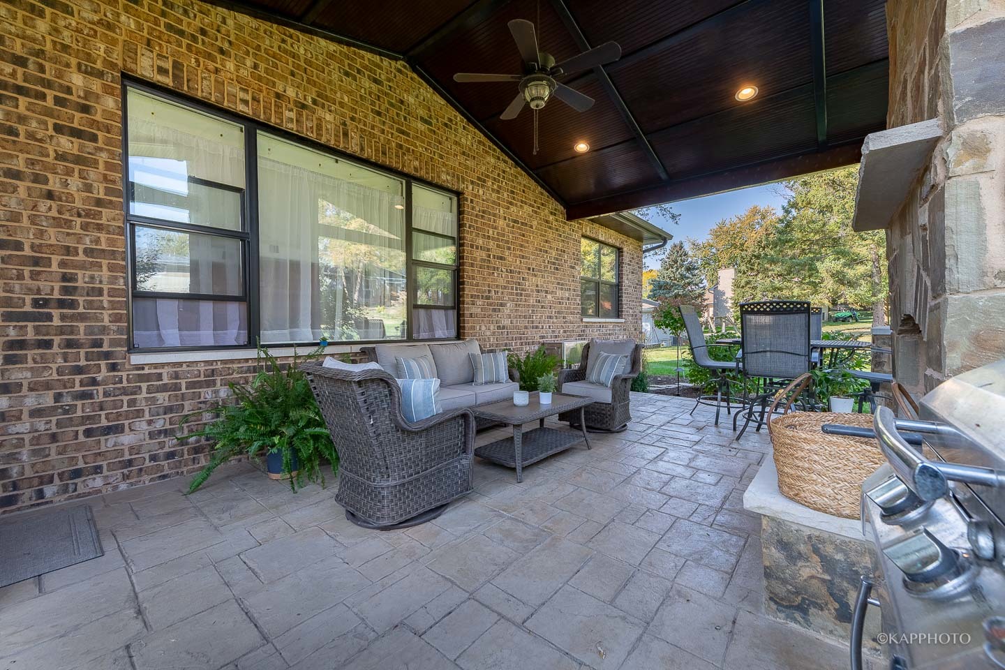 249 Easy Street Lake Holiday, IL 60552 - Photo 24 of 42 a view of a patio with table and chairs potted plants and floor to ceiling window