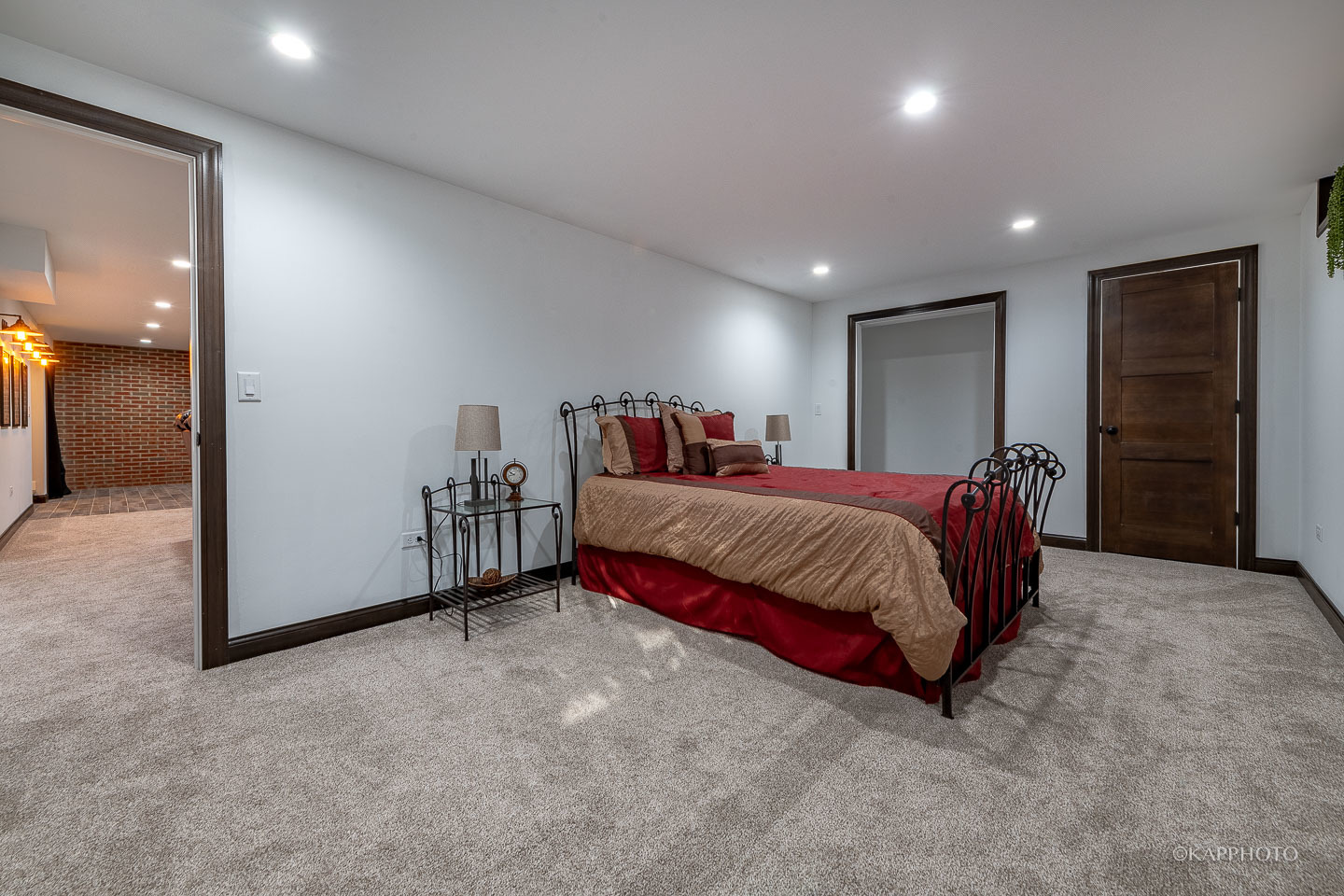 249 Easy Street Lake Holiday, IL 60552 - Photo 29 of 42 a spacious bedroom with a bed and a lamp