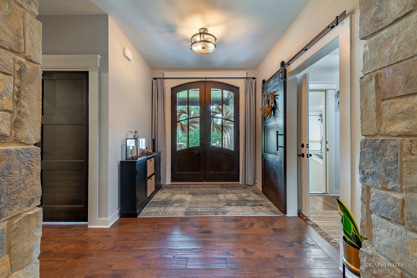 249 Easy Street Lake Holiday, IL 60552 - Photo 6 of 42 a view of a hallway with wooden floor and a bathroom