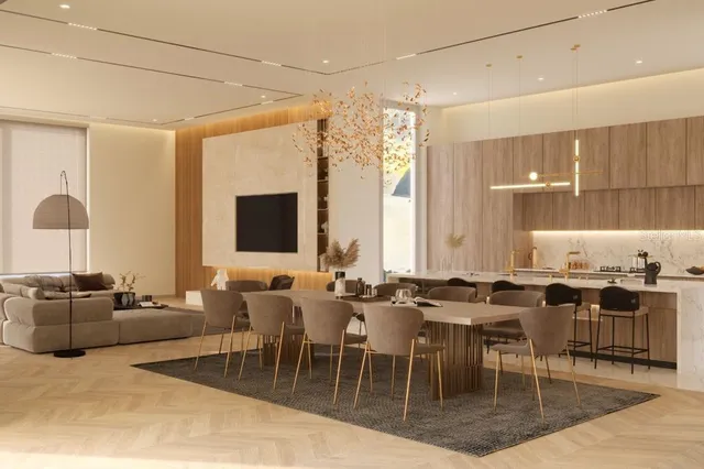 a living room with lots of furniture and kitchen view