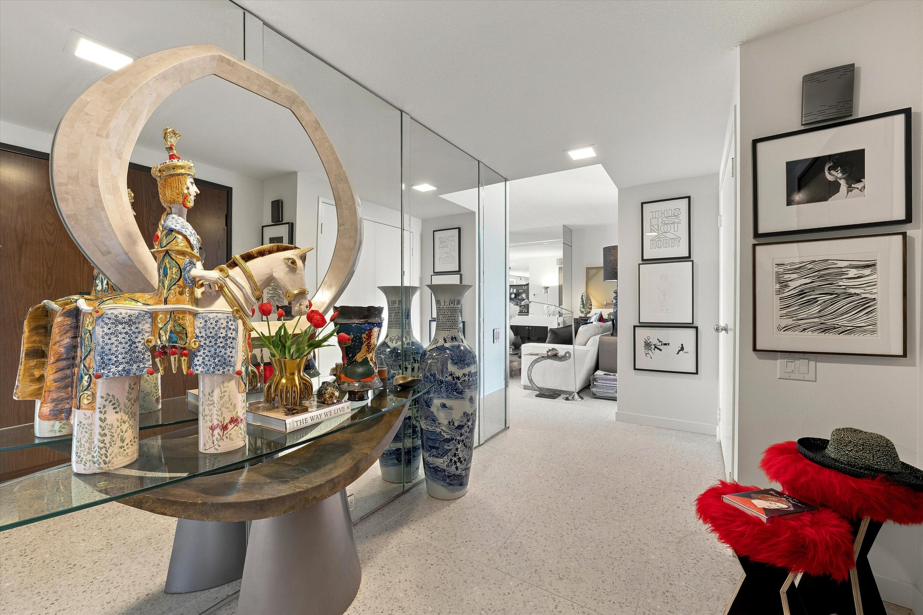 899 Island Drive, Unit 304 Rancho Mirage, CA 92270 - Photo 2 of 30 a room with lots of flower chairs