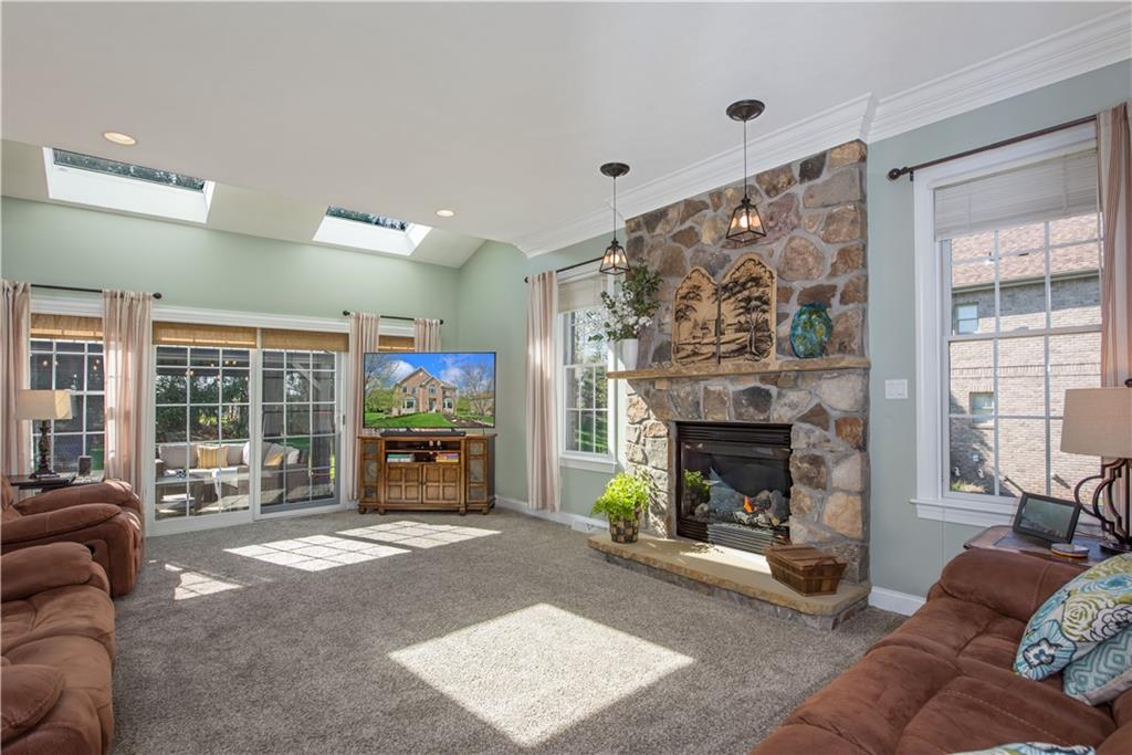 2019 Condor Lane Gibsonia, PA 15044 - Photo 16 of 39 a living room with furniture large window and a fireplace