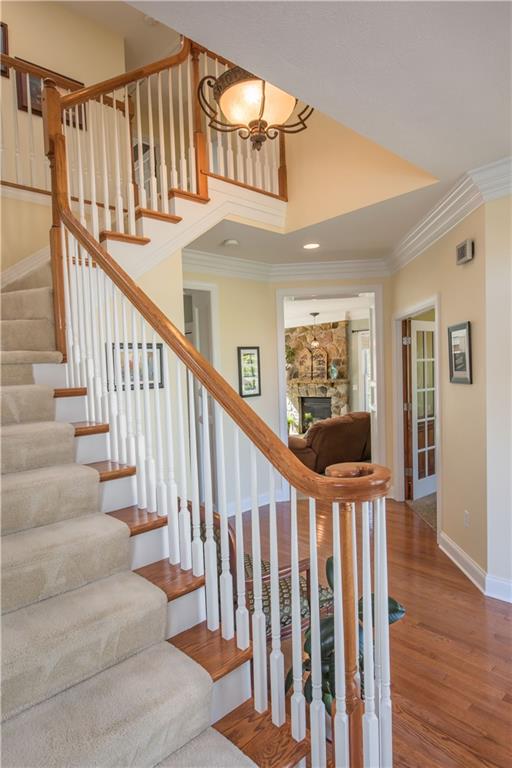 2019 Condor Lane Gibsonia, PA 15044 - Photo 19 of 39 a view of staircase with lots of frames on wall and wooden floor
