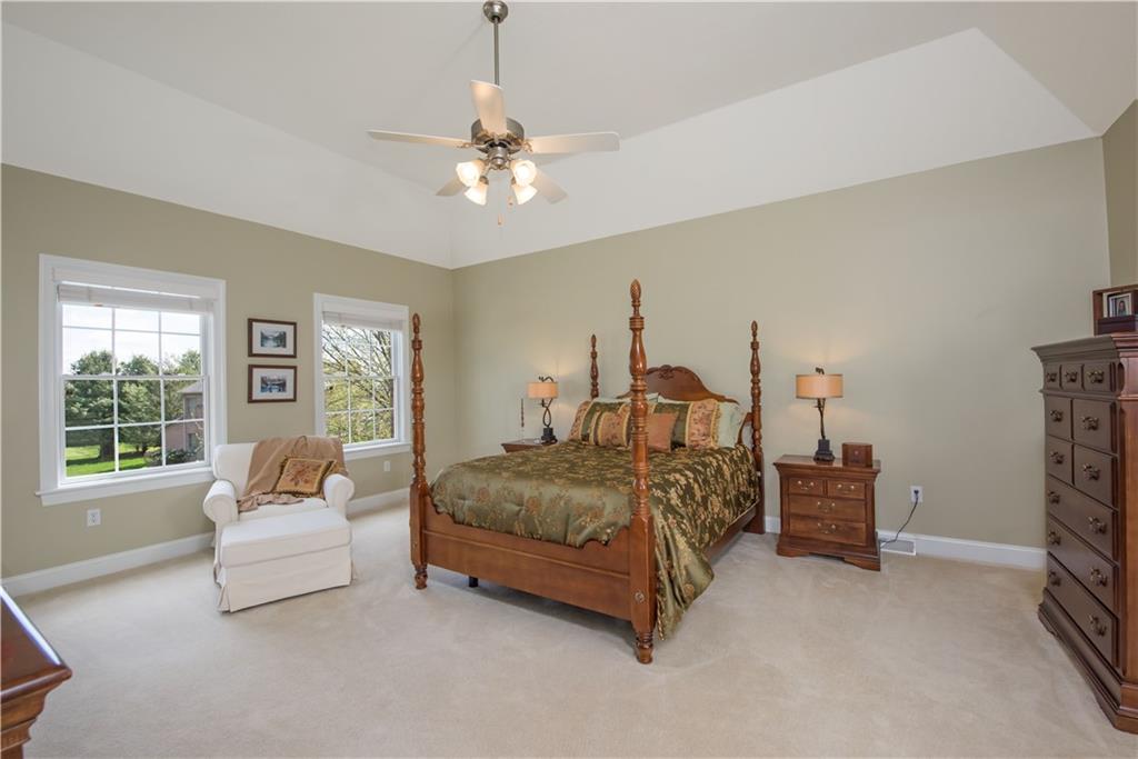 2019 Condor Lane Gibsonia, PA 15044 - Photo 20 of 39 a bedroom with a bed and a chandelier