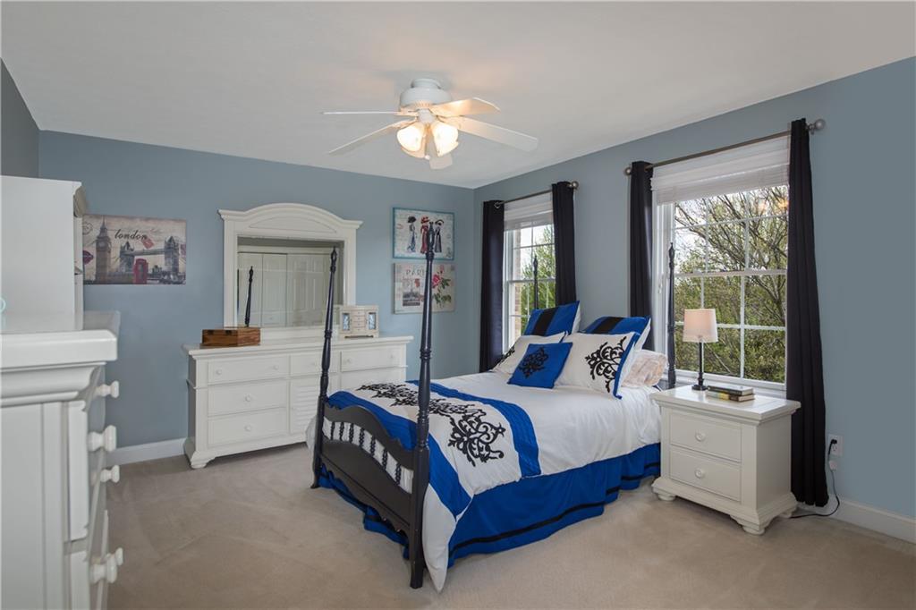 2019 Condor Lane Gibsonia, PA 15044 - Photo 25 of 39 a bedroom with a bed and a chandelier