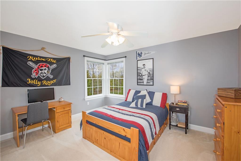 2019 Condor Lane Gibsonia, PA 15044 - Photo 27 of 39 a bedroom with a bed and a chandelier
