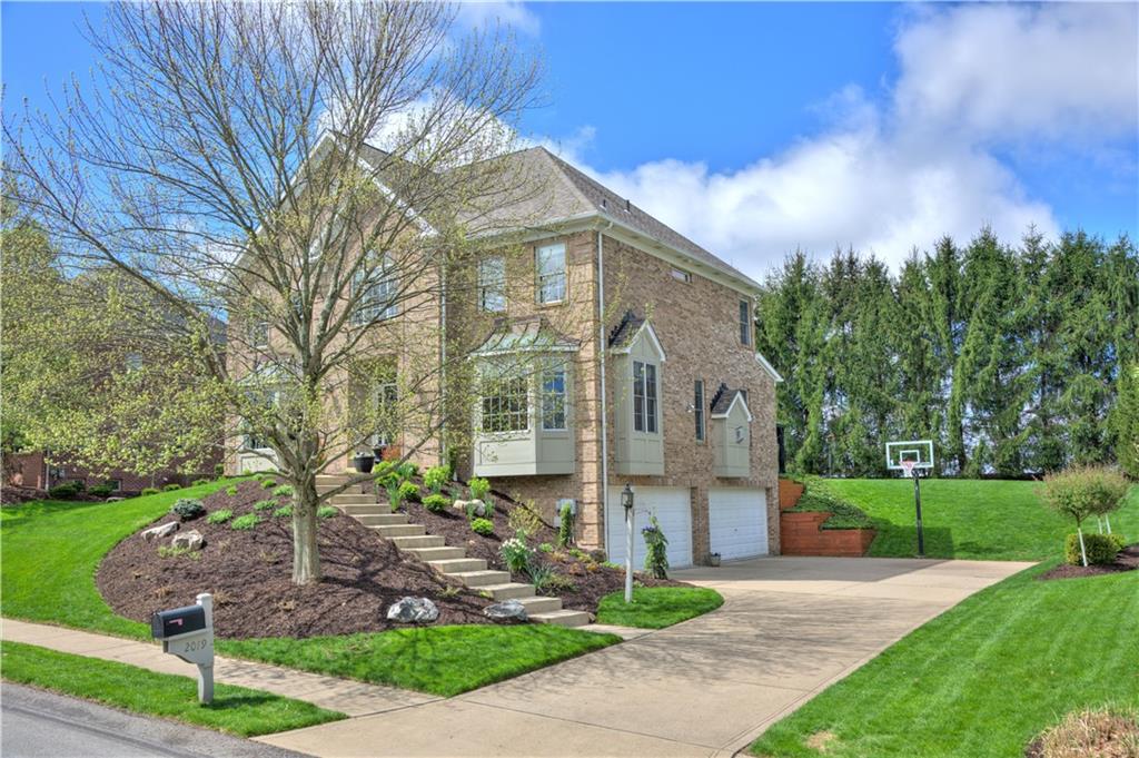 2019 Condor Lane Gibsonia, PA 15044 - Photo 3 of 39 a front view of a house with garden