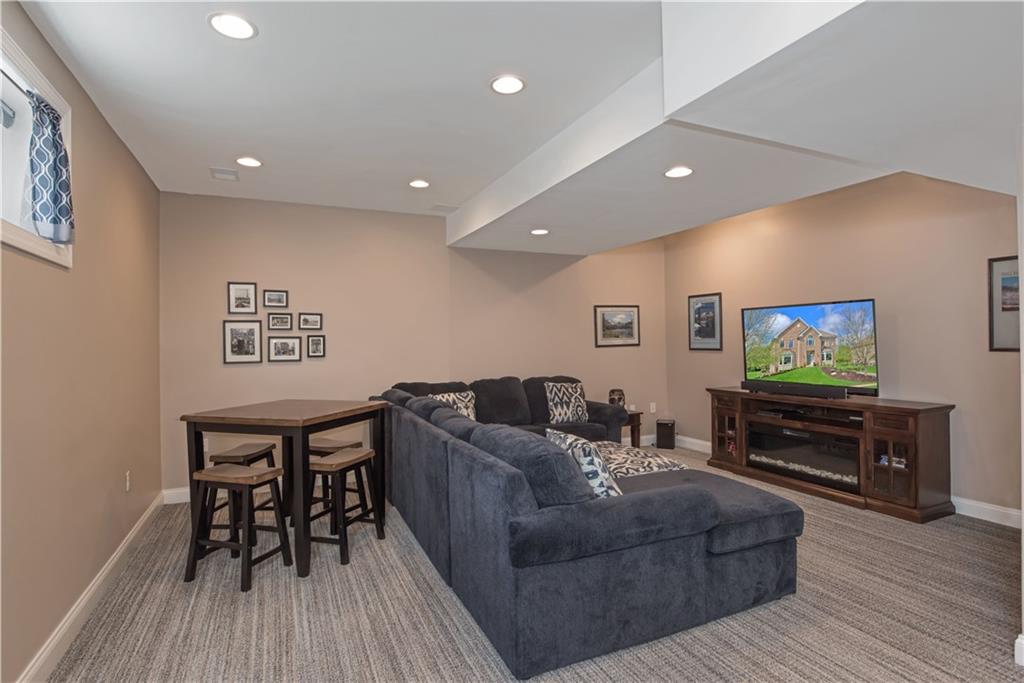 2019 Condor Lane Gibsonia, PA 15044 - Photo 31 of 39 a living room with furniture and a flat screen tv