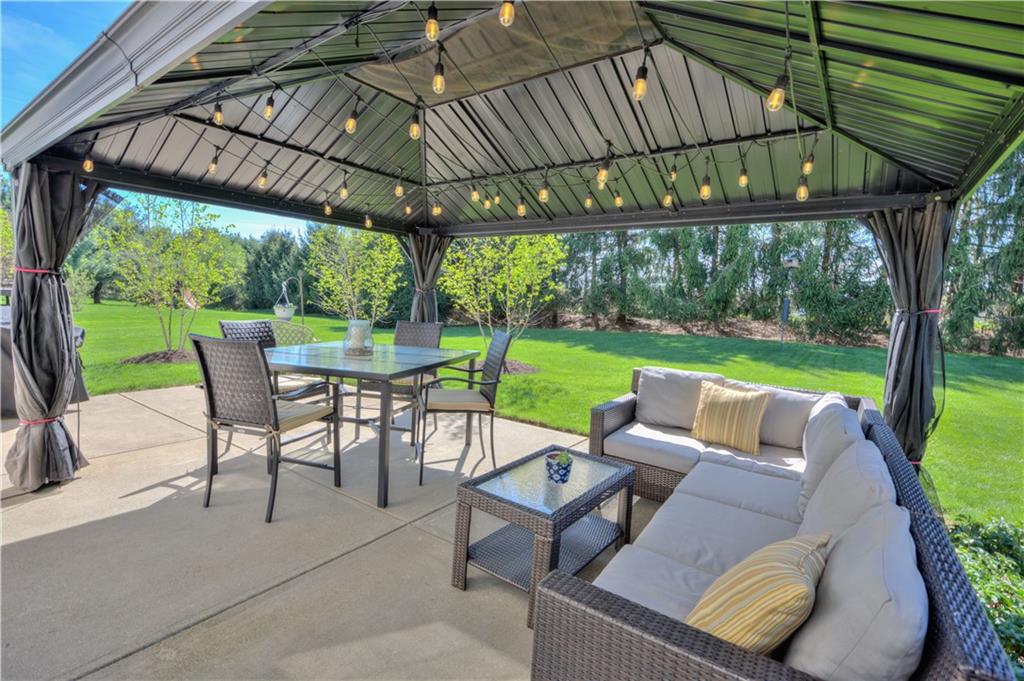 2019 Condor Lane Gibsonia, PA 15044 - Photo 33 of 39 a view of a patio with a table chairs and a backyard