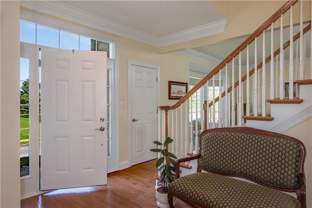 2019 Condor Lane Gibsonia, PA 15044 - Photo 6 of 39 a view of a hallway with wooden floor and staircase