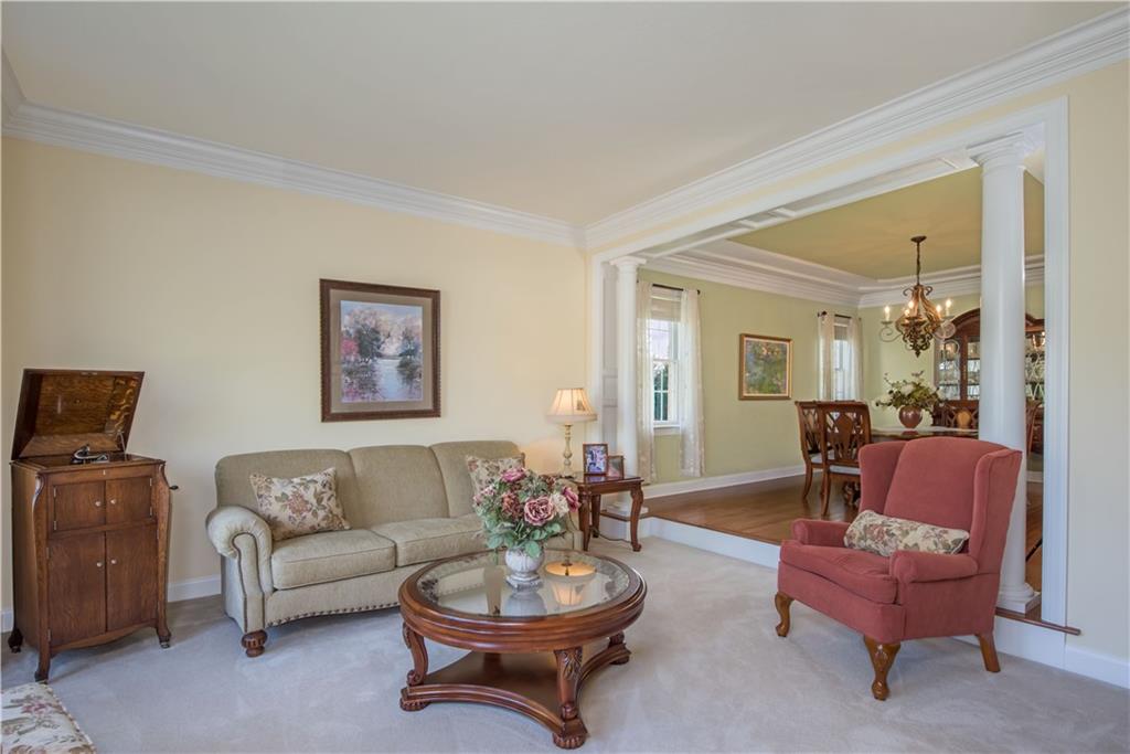 2019 Condor Lane Gibsonia, PA 15044 - Photo 8 of 39 a living room with furniture a rug and a mirror