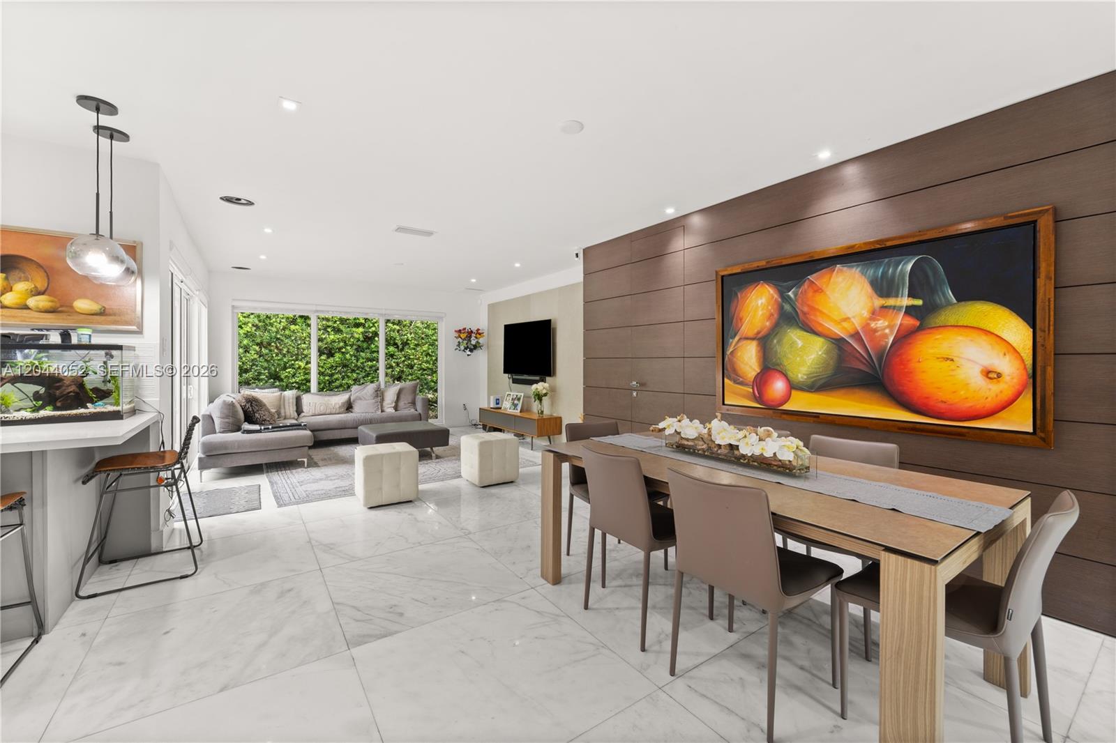 721 Bird Road Coral Gables, FL 33146 - Photo 3 of 24 a kitchen with a table and chairs