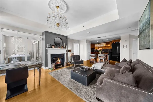 a living room with fireplace furniture and a window